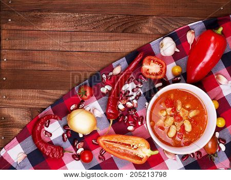 Tom Yum Goong Spicy Sour Soup on wooden table top view Thai local food