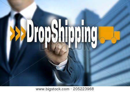 DropShipping touchscreen is operated by businessman picture
