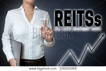 Reits touchscreen is shown by businesswoman picture