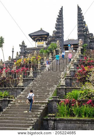 Besakih Indonesia - September 9 2017: Visitors explore the immense Pura Besakih Temple (Royal Temple of Besakih). the most important temple and holiest Hindu temple in Bali.
