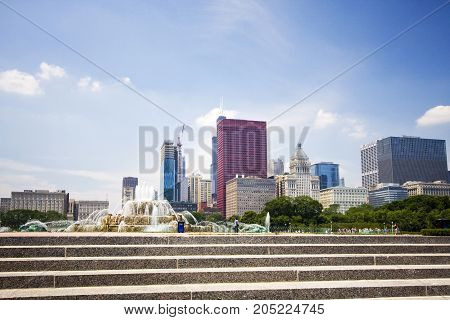 Chicago downtown skyline view with staircase and Buckingham fountain in Grant Park on the foreground on a sunny summer day.