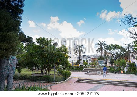 Quito, Ecuador - 28 APRIL, 2015: Unidentified people working in the park to fix all the damaged parts in the park in the valley of Los Chillos.