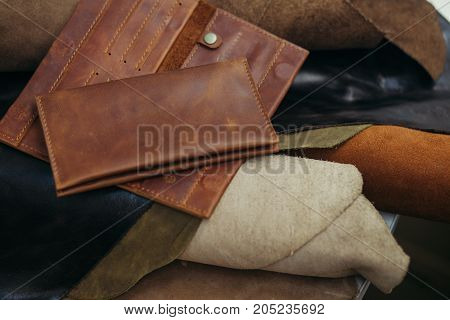 Purses in different styles which made from colorful genuine leather.