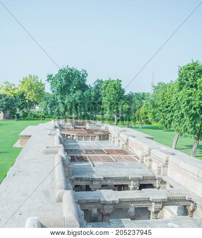 Adalaj step well or Waav as seen on the ground surface is surrounded by garden