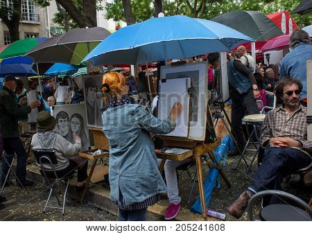 Paris France - July 24 2011: Street artists sell their painting in Place du Tertre