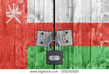 Oman flag on door with padlock close