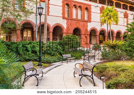 Saint Augustine Florida USA - January 18 2016: The inner courtyard of Flagler College with alleys and benches