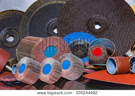 A pile of color abrasive sandpaper for metal working sandpaper for metal working