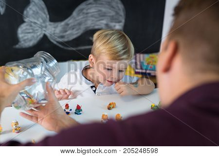 Cute little playfull toddler boy at child therapy session. Private one on one homeschooling with didactic aids.