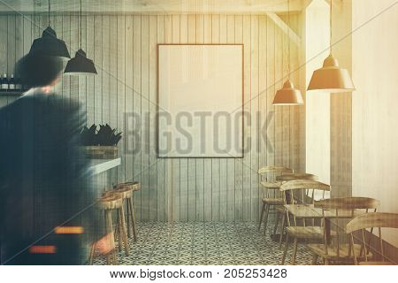 White wooden bar with a diamond floor pattern white bar stand with a row of black stools near it and wooden tables and chairs. A poster a man 3d rendering mock up toned image double exposure