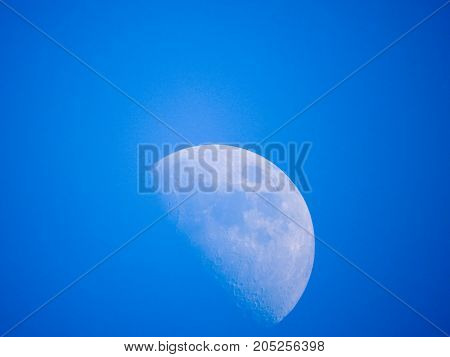 Photo of moon phase catching craters on it's surface