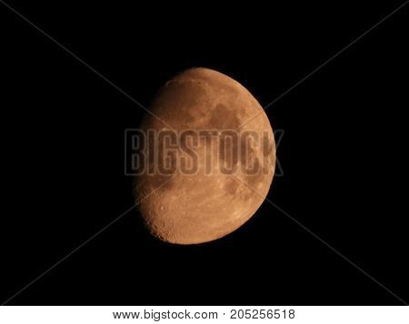 Photo of moon phase catching craters on it's surface