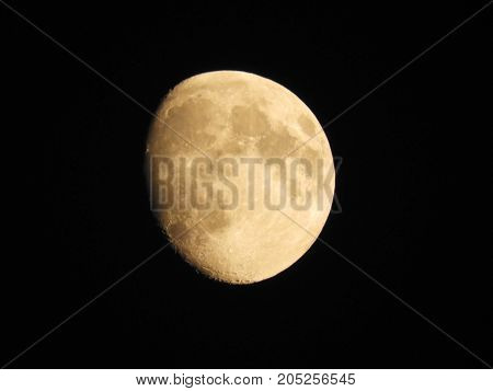 Photo of moon phase catching craters on it's surface