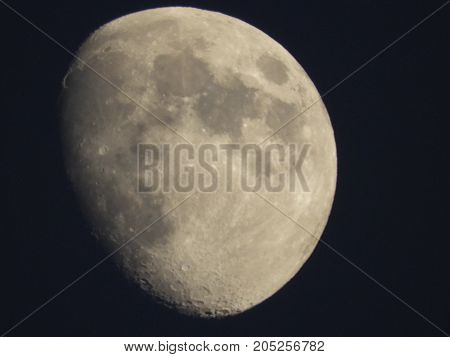 Photo of moon phase catching craters on it's surface
