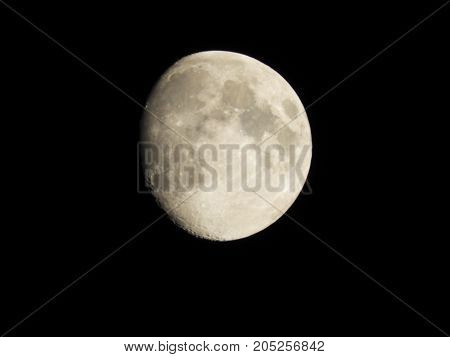 Photo of moon phase catching craters on it's surface