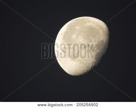 Photo of moon phase catching craters on it's surface