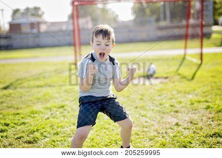 A Young caucassian soccer player football outside