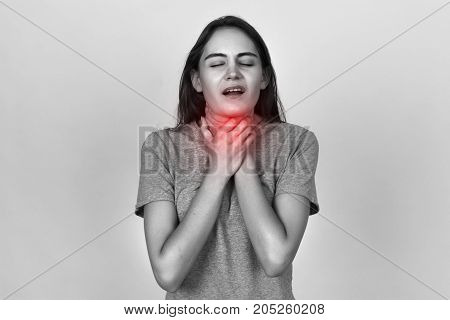 Young Woman With Sore Throat.. Black And White With Red Accent