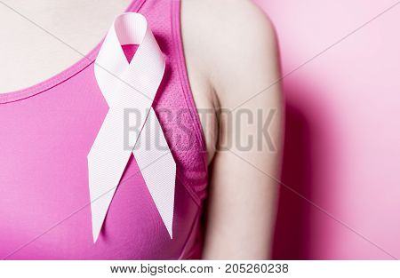 A Fight for Breast Cancer woman with symbol on pink background