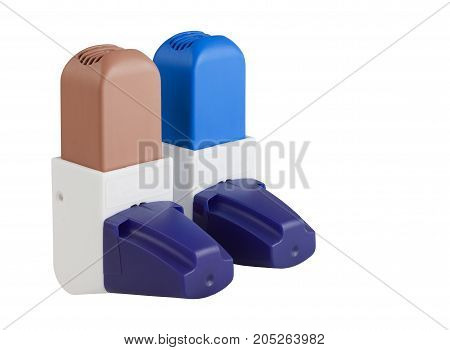 Blue and Brown Asthma Inhalers with caps isolated on white with clipping path