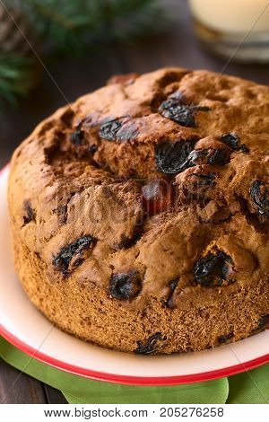Traditional Chilean Pan de Pascua Christmas Cake made with spices dried fruits and raisins photographed with natural light (Selective Focus Focus one third into the cake)