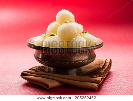 Stock Photo of Rasgulla or sponge Ras Gulla, It is made from ball shaped dumplings of chhena and semolina dough, cooked in light syrup made of sugar.