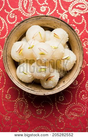Stock Photo of Rasgulla or sponge Ras Gulla, It is made from ball shaped dumplings of chhena and semolina dough, cooked in light syrup made of sugar.