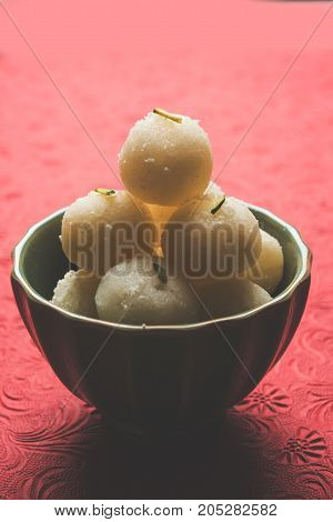 Stock Photo of Rasgulla or sponge Ras Gulla, It is made from ball shaped dumplings of chhena and semolina dough, cooked in light syrup made of sugar.