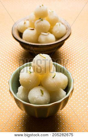 Stock Photo of Rasgulla or sponge Ras Gulla, It is made from ball shaped dumplings of chhena and semolina dough, cooked in light syrup made of sugar.