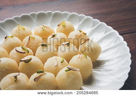 Stock Photo of Rasgulla or sponge Ras Gulla, It is made from ball shaped dumplings of chhena and semolina dough, cooked in light syrup made of sugar.