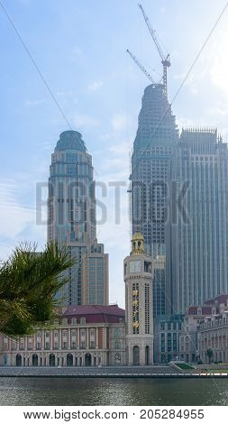 Tianjin, China - Nov 1, 2016: Commercial skyline across the Haihe River. Buildings in contrasting modern and old architectural style.