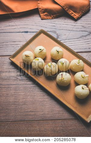Stock Photo of Rasgulla or sponge Ras Gulla, It is made from ball shaped dumplings of chhena and semolina dough, cooked in light syrup made of sugar.