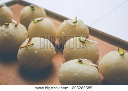Stock Photo of Rasgulla or sponge Ras Gulla, It is made from ball shaped dumplings of chhena and semolina dough, cooked in light syrup made of sugar.