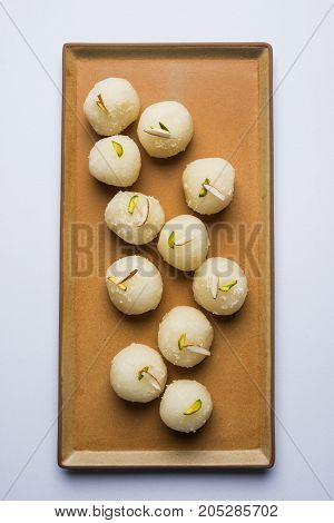 Stock Photo of Rasgulla or sponge Ras Gulla, It is made from ball shaped dumplings of chhena and semolina dough, cooked in light syrup made of sugar.