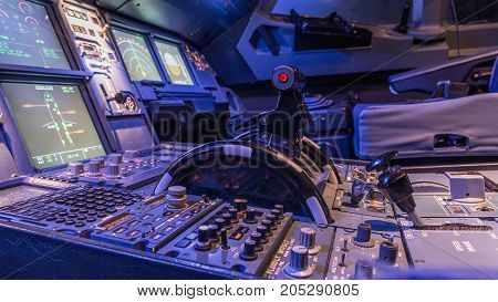 Engine lever in the cockpit of an airliner. Center console and throttles in an airplane