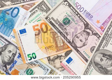 Close up of US dollar and euro banknote money. High resolution photo.