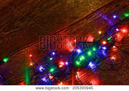 Christmas rustic background - vintage planked wood with lights and free text space.