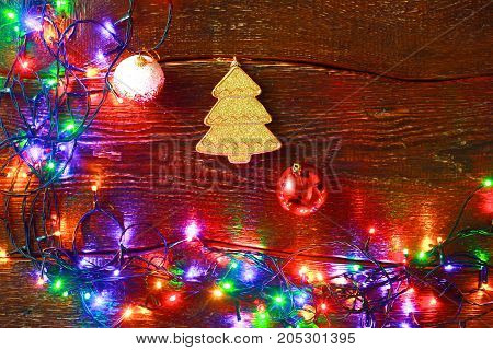 Christmas rustic background - vintage planked wood with lights and free text space.