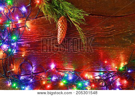 Christmas rustic background - vintage planked wood with lights and free text space.