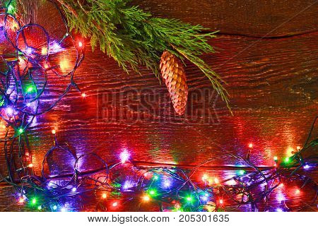Christmas rustic background - vintage planked wood with lights and free text space.
