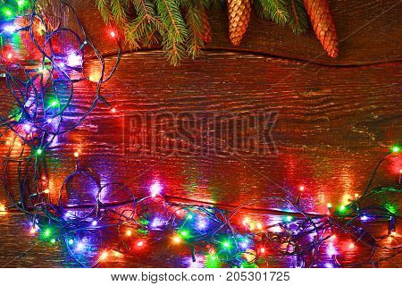 Christmas rustic background - vintage planked wood with lights and free text space.