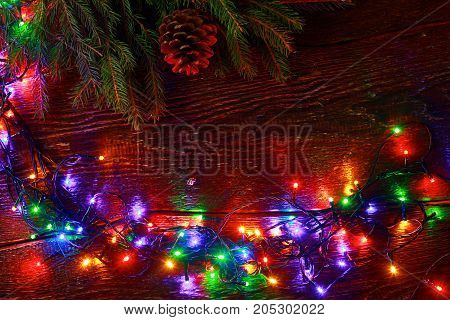 Christmas rustic background - vintage planked wood with lights and free text space.