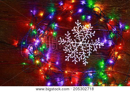 Christmas rustic background - vintage planked wood with lights and free text space.