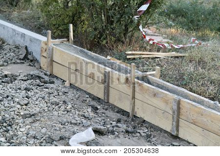 The repair of the road. Pictures of repairing of pedestrian sidewalk. Setting the border