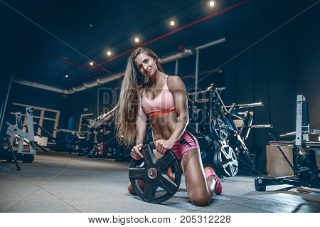 Sexy Athletic Young Girl Training Back In Gym