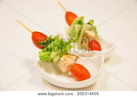 A skewers with cherry tomatoes and vegetale