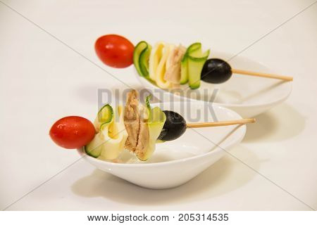 A skewers with cherry tomatoes and vegetale