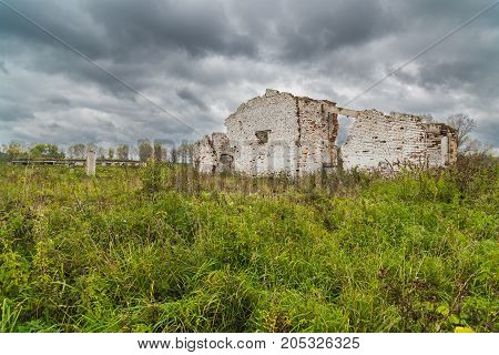 The old destroyed cowshed of the Soviet period in Russia
