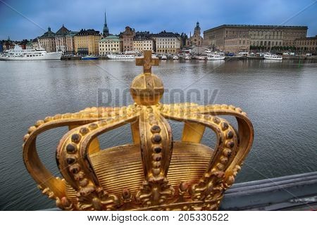 Skeppsholmsbron (Skeppsholm Bridge) with Golden Crown on a bridge in Stockholm Sweden