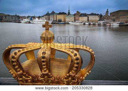 Skeppsholmsbron (Skeppsholm Bridge) with Golden Crown on a bridge in Stockholm Sweden